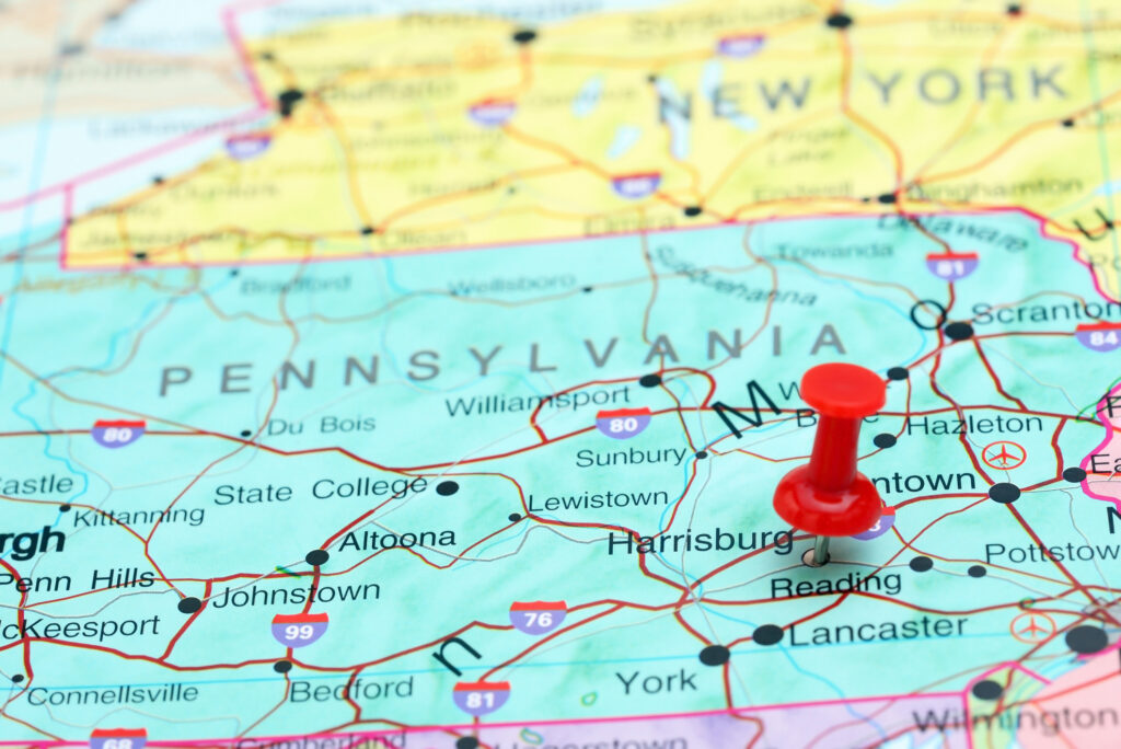 Red pushpin marking central Pennsylvania on a road map, highlighting key fleet maintenance franchise territory opportunities across the state.